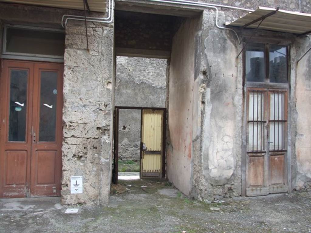 IX.2.16 Pompeii. December 2007. Atrium, looking south along fauces to main entrance.
On 4th March 1869 a seal attributed to Tito Decio (?) Panthera, was found here. 
According to Fiorelli, the two rooms on either side of the entrance corridor were cubicula.
Found in the cubiculum on the left, on the south wall, was a painting of a landscape. 
See BdI, 1871, (p.201).

