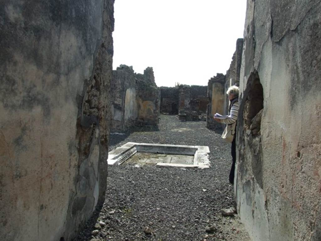 IX.2.18 Pompeii. March 2009. Looking west along entrance corridor to atrium, Room 1.