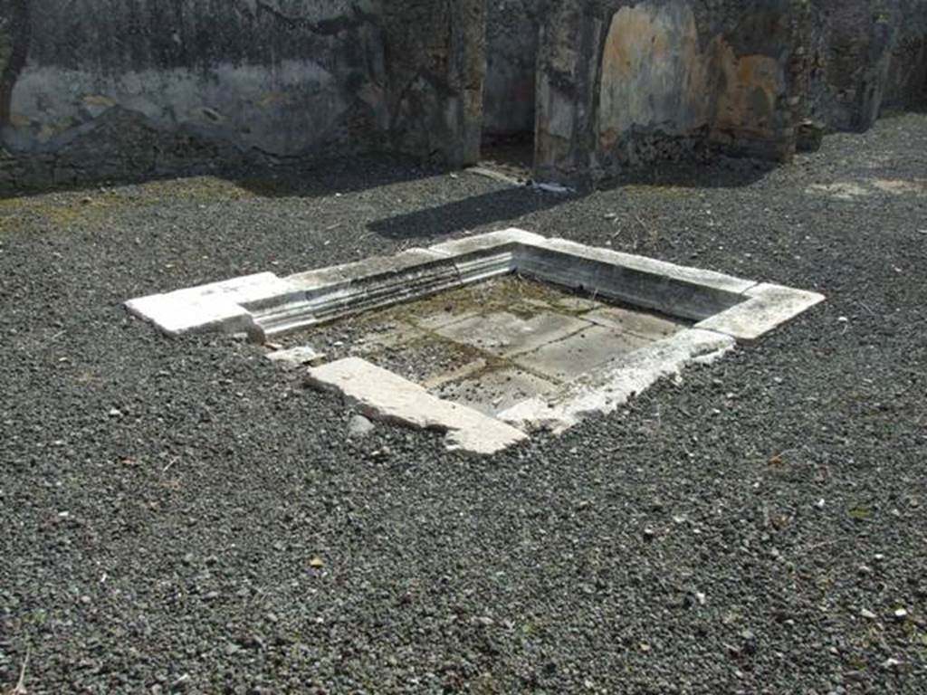 IX.2.18 Pompeii. March 2009. Room 1, travertine impluvium in atrium. Looking south-west.
