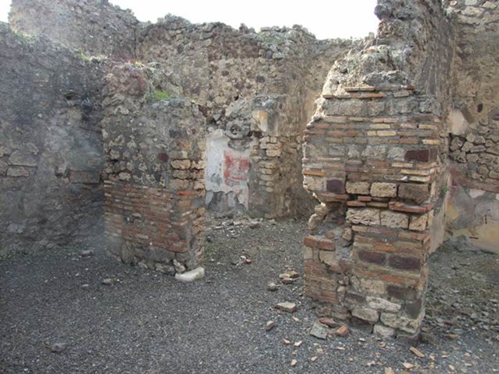IX.2.21 Pompeii. March 2009. Doorways to rooms 13 and 14, from north portico.  According to Boyce, in these two cubicula many objects were found including jewellery and four bronze statuettes:
One was Abbondanza holding a cornucopia in the left hand and a patera in the right  probably the Genius -
and Minerva, helmeted and holding a spear in the right hand, and a shield on the left arm.
Also found were the two Lares, each holding rhyton and patera.
See Boyce G. K., 1937. Corpus of the Lararia of Pompeii. Rome: MAAR 14. (p.81)
Boyces reference was given as Giorn. Scavi, N.S., ii, 1872, 281. 
