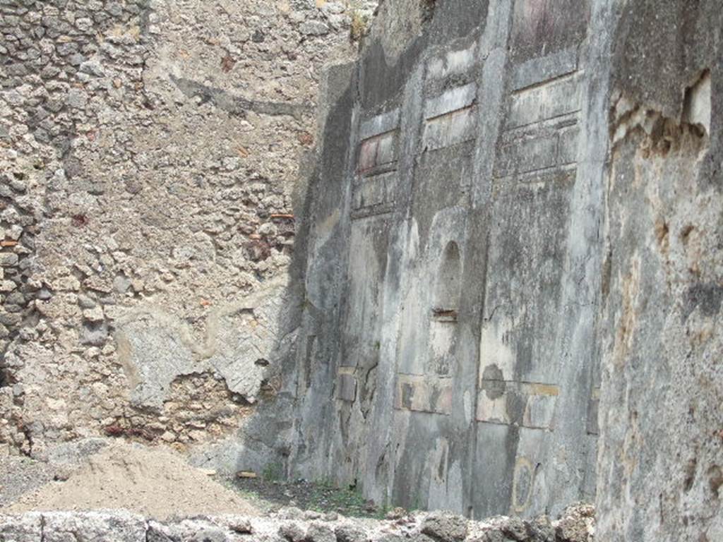 IX.3.2 Pompeii.  May 2006. Stucco decoration in the first style on the south wall of garden.