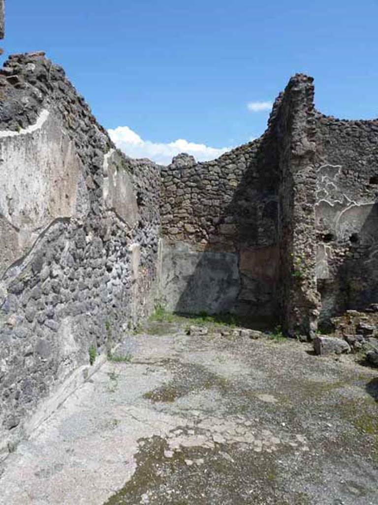 IX.3.3 Pompeii. May 2010. Looking east across shop towards rear room.