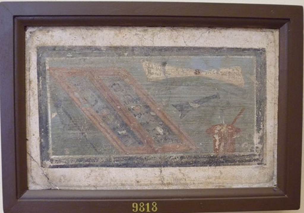 IX.3.5 Pompeii.  Room 19, wall painting of writing implements and a letter with the address of M.  Lucretio,  Flam(ini)  Martis,  Decurioni  –  Pompeis    [CIL IV 879]  The letter, or scroll with the writing, can be seen in the top right hand corner.  Found in the second passage or second room left from the peristyle.  Now in Naples Archaeological Museum.  Inventory number 9818.
See Della Corte, M., 1965.  Case ed Abitanti di Pompei. Napoli: Fausto Fiorentino.(p. 161)
See Engelmann, W., 1929.  New Guide to Pompeii: Second Edition.  Engelmann. (p.120).
See Helbig, W., 1868. Wandgemälde der vom Vesuv verschütteten Städte Campaniens. Leipzig: Breitkopf und Härtel. (1722).
