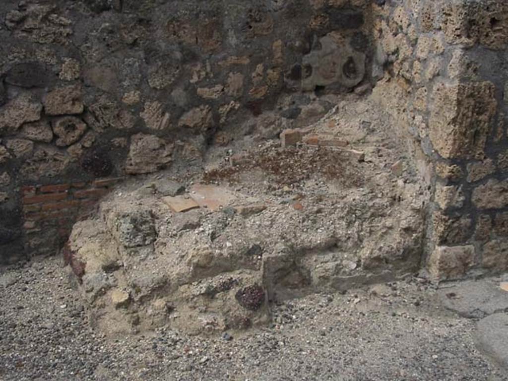 IX.3.10 Pompeii. May 2003. Masonry remains on north side of doorway linking shop to bakery.  Photo courtesy of Nicolas Monteix.