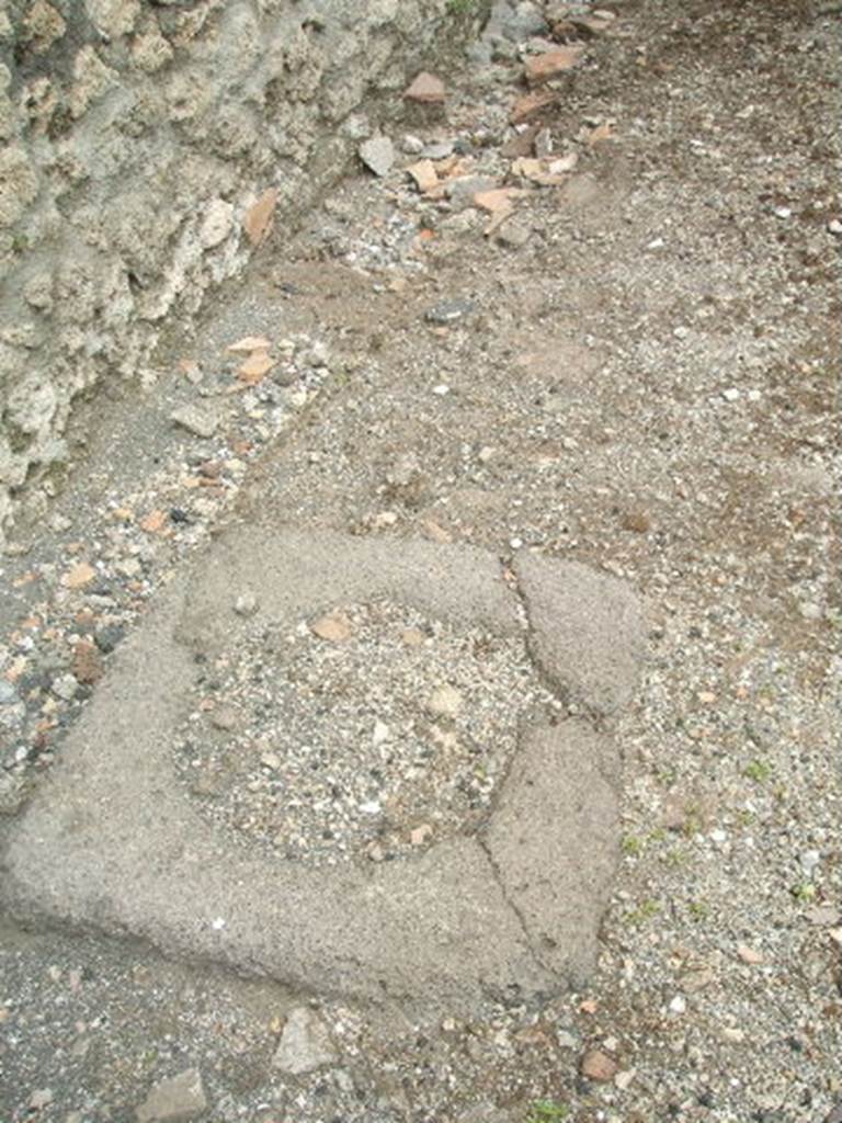 IX.3.12 Pompeii.  May 2005.  Room to west of kitchen.  Cistern mouth.