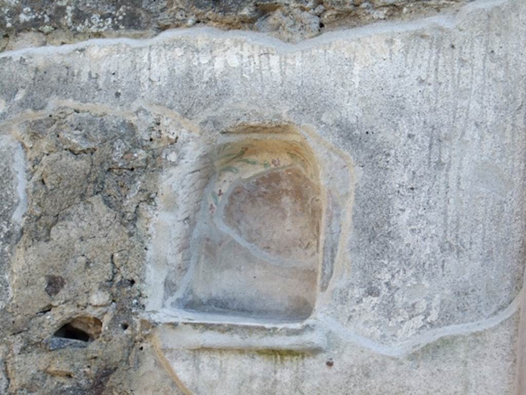 IX.3.12 Pompeii. March 2009. Niche on south wall. According to Boyce, the niche had green and brown leaves and red flowers. On the white plaster surrounding the niche, there were paintings. See Boyce G. K., 1937. Corpus of the Lararia of Pompeii. Rome: MAAR 14. (p.83 and Pl.26,1).