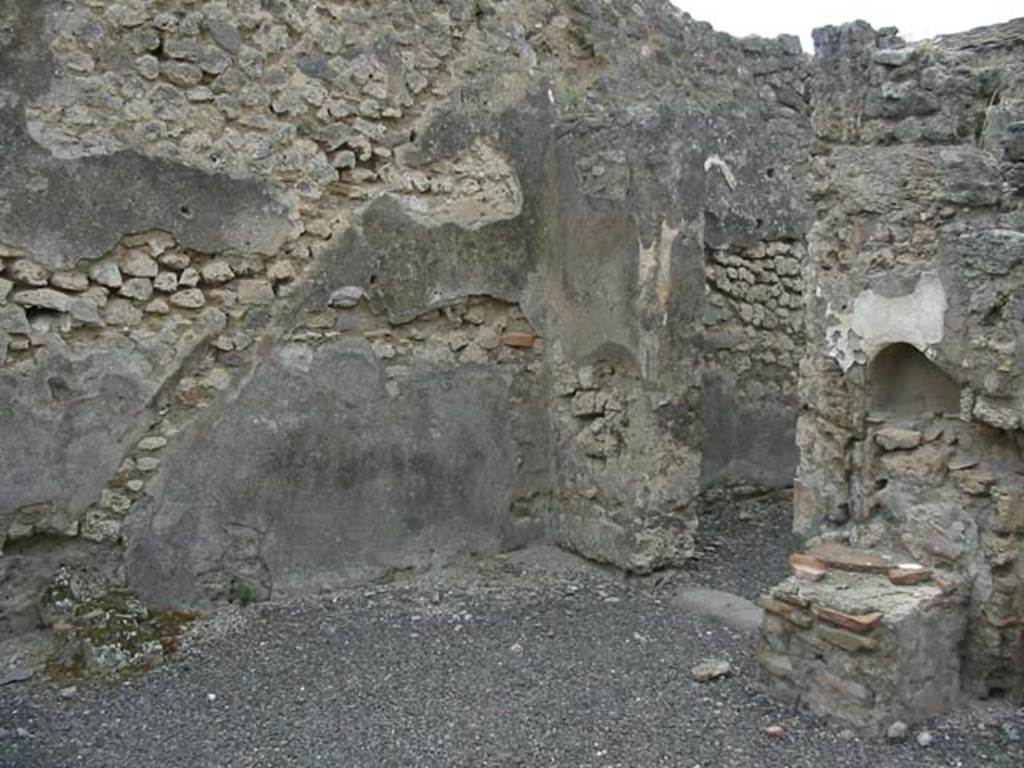 IX.3.14 Pompeii. May 2003. Outline of staircase in the plaster on west wall, and niche and altar on north wall. Photo courtesy of Nicolas Monteix.