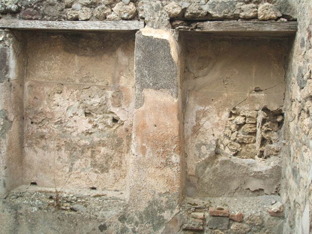 IX.3.14 Pompeii. May 2005. Two recesses in room in north-east corner of shop-room.