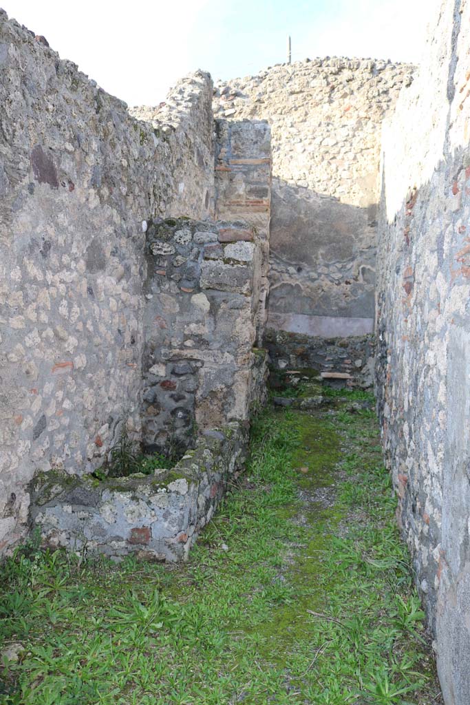 IX.3.14 Pompeii. December 2018.
Looking north along corridor to rear on west side, containing the fusorium, hearth and the latrine.
Photo courtesy of Aude Durand.