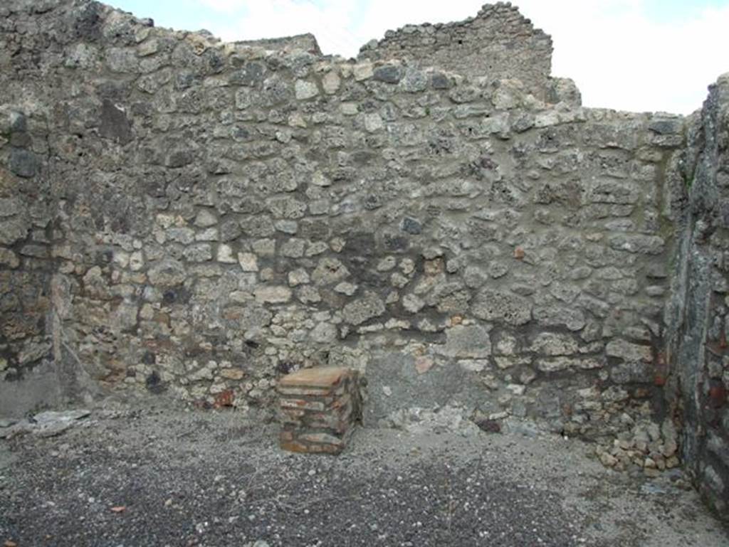IX.3.17 Pompeii. March 2009. Masonry altar on east side of workshop.   