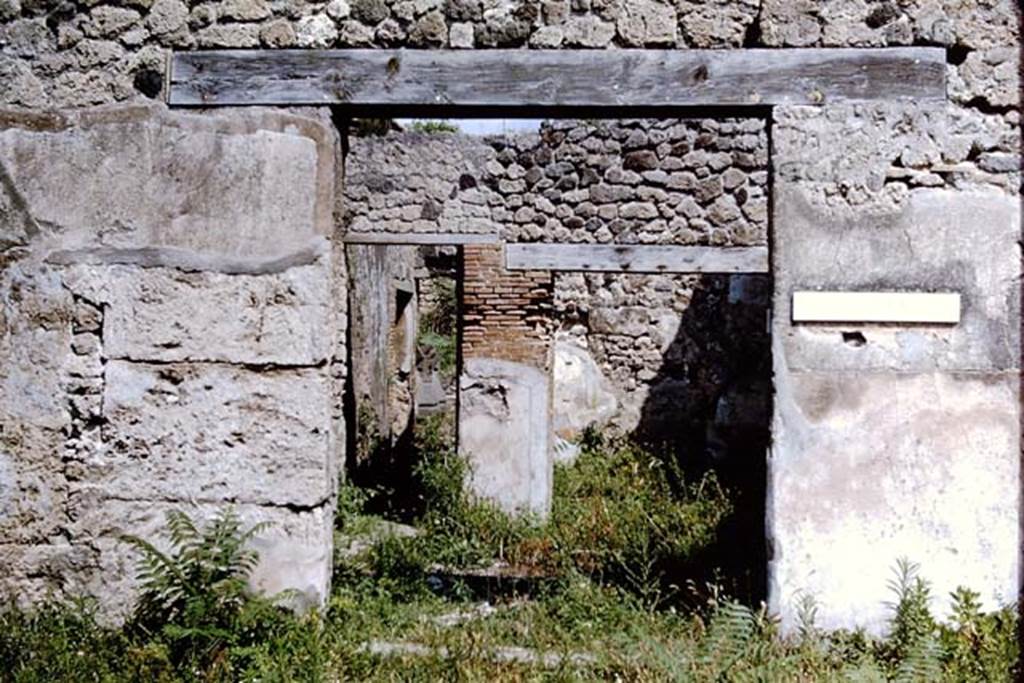 IX.3.19 Pompeii. 1964. Entrance doorway to shop-room of bakery. The corridor leading to/from the bakery is left of centre of photo. Photo by Stanley A. Jashemski.  
Source: The Wilhelmina and Stanley A. Jashemski archive in the University of Maryland Library, Special Collections (See collection page) and made available under the Creative Commons Attribution-Non Commercial License v.4. See Licence and use details.
J64f1604
