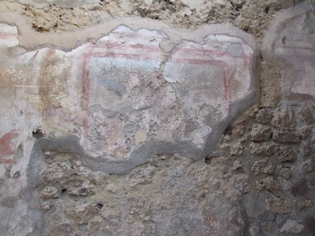 IX.5.2 Pompeii. December 2007. Room 4, detail of remains of painting on east wall. According to PPP, the wall painting in the centre of the east wall was of a masculine figure, possibly Helios. See Bragantini, de Vos, Badoni, 1986. Pitture e Pavimenti di Pompei, Parte 3. Rome: ICCD. (p.450)