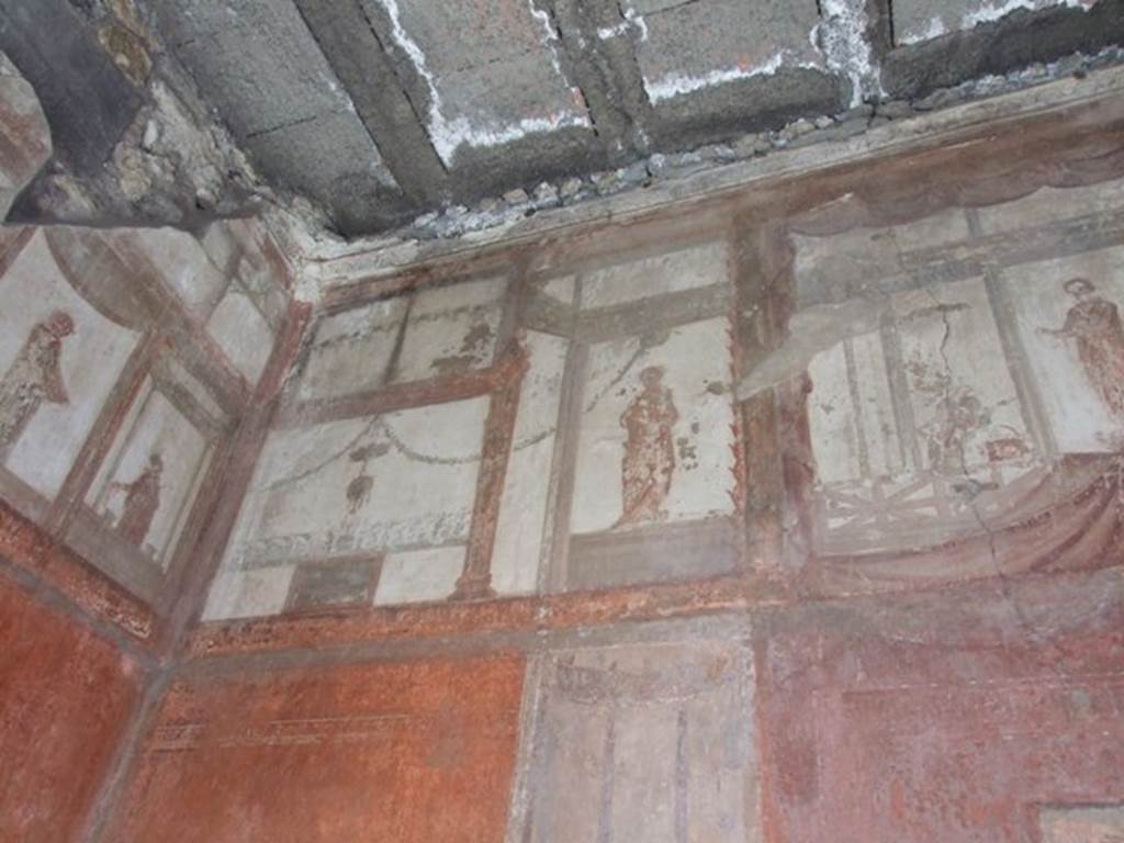 IX.5.6 Pompeii. December 2007. Room 10, east wall of tablinum. Wall painting of figures or gods at high level.
