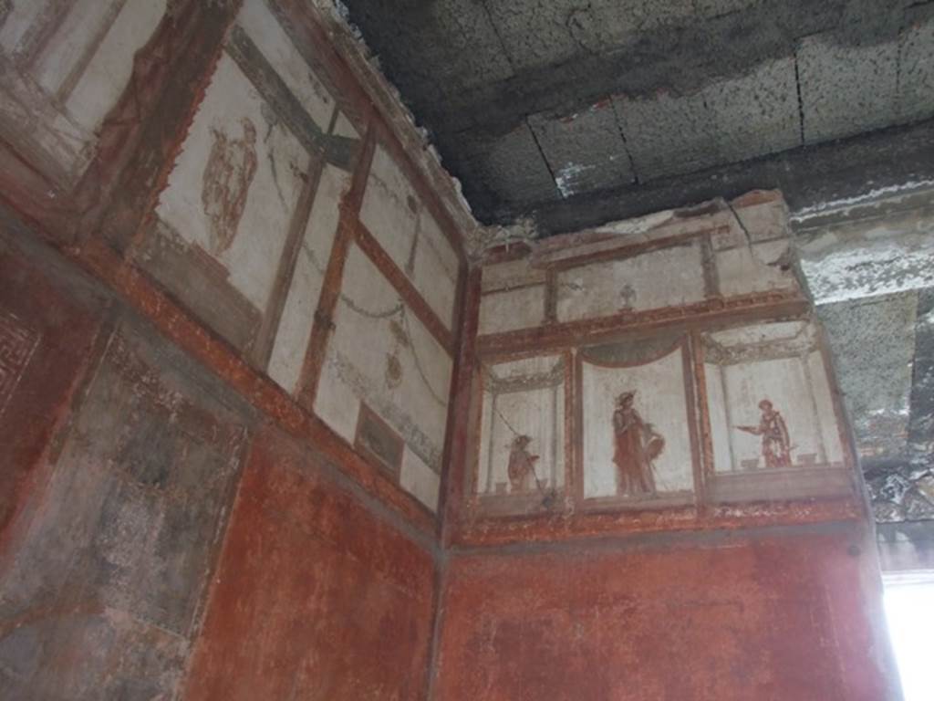 IX.5.6 Pompeii. December 2007. Room 10, upper south-east corner and south wall of tablinum. Wall painting of figures or gods at high level.