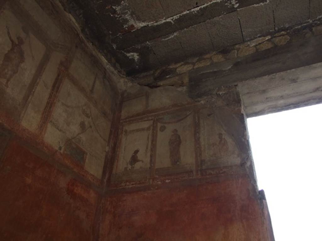 IX.5.6 Pompeii. December 2007. Room 10, upper north-west corner of tablinum. Wall painting of figures or gods at high level.