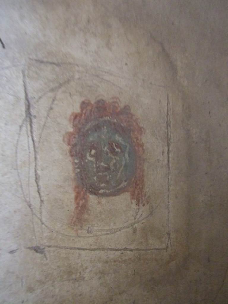 IX.5.6 Pompeii. December 2007. Room 8, wall painting of a mask in corridor on east side of tablinum.