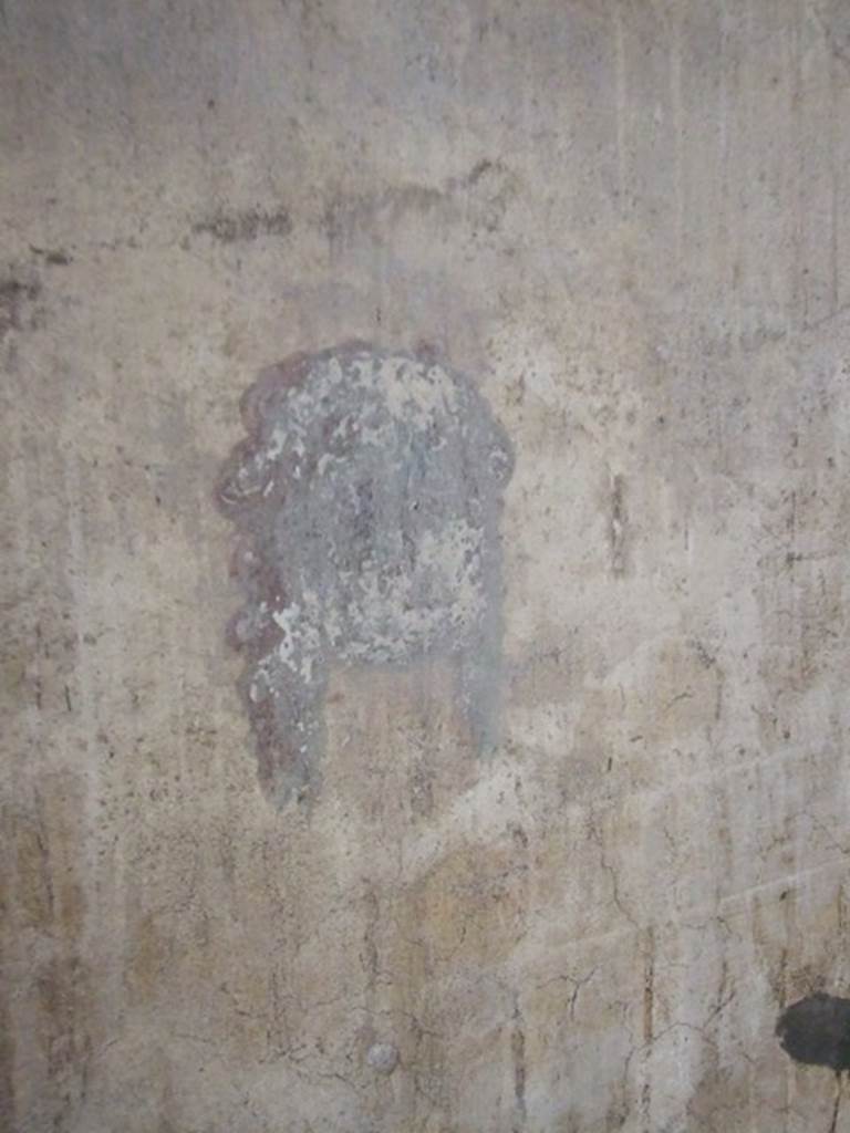 IX.5.6 Pompeii. December 2007.
Room k, wall painting of a head or mask at north end of corridor on west wall.