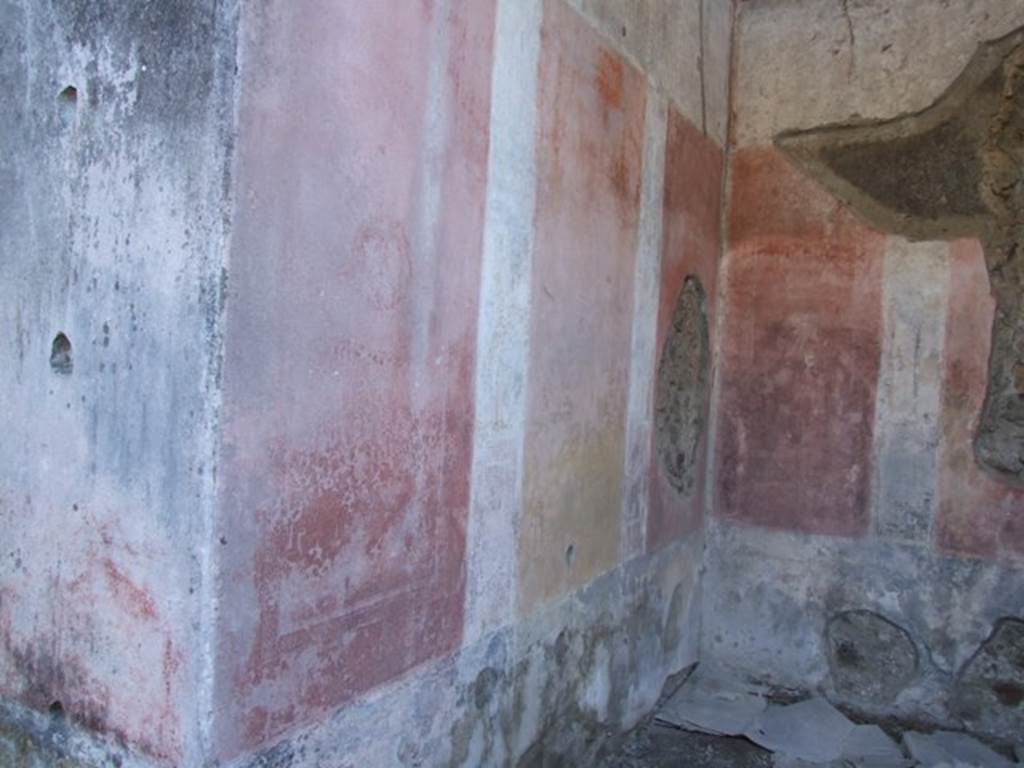 IX.5.11 Pompeii. December 2007. Room 8, south wall and south-west corner of ala. The remains of a faded medallion can hardly be seen in the red panel, left of centre. 
See Schefold, K., 1962. Vergessenes Pompeji. Bern: Francke. (Fig.132.3 [h]: Sudwand)

