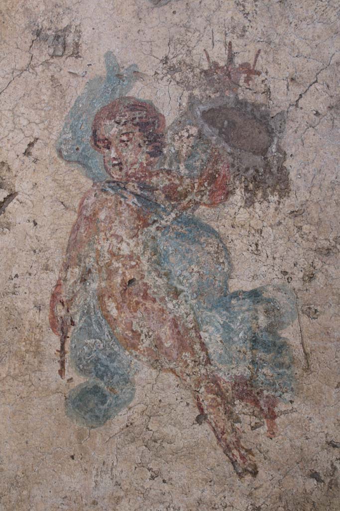 IX.5.16 Pompeii. May 2019. Room f’, detail of flying cupid with cornucopia.
Foto Christian Beck, ERC Grant 681269 DÉCOR.