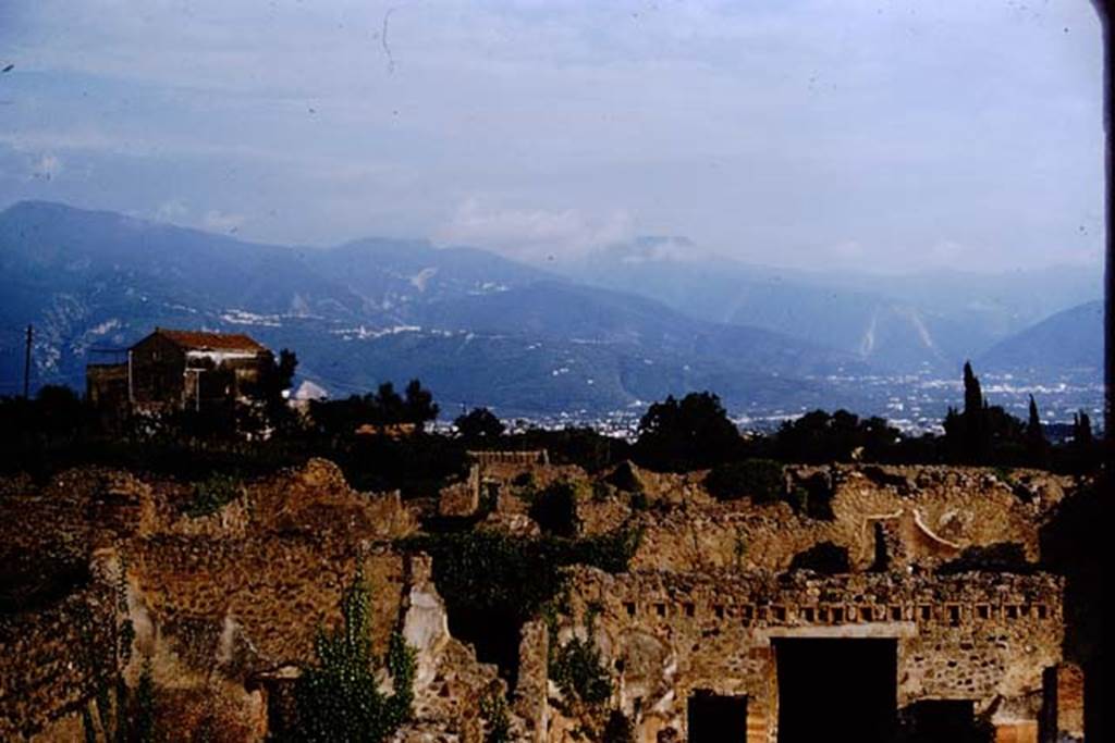 IX.5.18 Pompeii. 1964. Looking south across Pompeii. 
The entrance corridor from the inside of the atrium of IX.5.18 can be seen in the lower right, with the doorway to room h, on its left.  
Photo by Stanley A. Jashemski.
Source: The Wilhelmina and Stanley A. Jashemski archive in the University of Maryland Library, Special Collections (See collection page) and made available under the Creative Commons Attribution-Non-Commercial License v.4. See Licence and use details.
J64f1257
