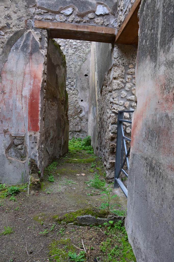 IX.5.18 Pompeii. March 2017. Room c, looking east from entrance at IX.5.19.
Note the remains of two walls which would have formed a small square room at the base of the stairs to the upper floor.
Foto Christian Beck, ERC Grant 681269 DÉCOR.