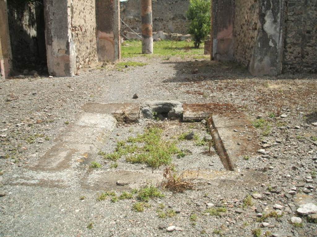IX.6.5 Pompeii. May 2005. Tufa impluvium in atrium 2, looking east.