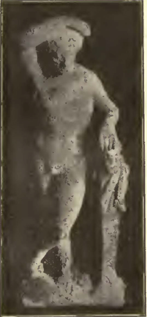 IX.7.11 Pompeii.
Discovered 1912 to the left of the entrance at a depth from 1.70m down to the threshold level.
Corroded bronze statuette 18 cm high, discovered with a bronze statuette of a dog, and a naked cupid with the attributes of Hercules.
See Notizie degli Scavi di Antichità, 1912, p.333-336, fig. 4, see below.
Kuivalainen describes –
A naked man stands with his weight on his left foot, with the right leg crossed. His abdominal and pectoral muscles are marked; he looks straight ahead, his wreathed hair is curly and drawn back in a bun; he rests his right hand on top of his head and leans with his right elbow on a herm; in the middle of his shoulder blades there is a tang for attachment. The bearded hip-herm wears a short chlamys across his torso.
Kuivalainen comments –
This is a unique Pompeian instance, with Bacchus leaning on a herm depicting Silenus. His more usual support was either a short column or Silenus himself. The legs crossed position is rare in Pompeii but is known from the wall painting from the Villa dei Misteri (F19). …………………………
See Kuivalainen, I., 2021. The Portrayal of Pompeian Bacchus. Commentationes Humanarum Litterarum 140. Helsinki: Finnish Society of Sciences and Letters, (H15, p.220).