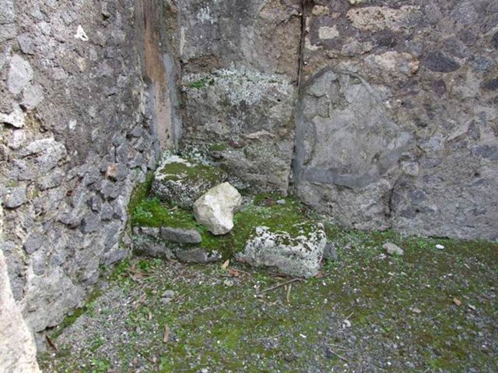 IX.8.2 Pompeii. March 2009. South east corner of rear room, with stone base for stairs to wooden pergula. The latrine was under the stairs.