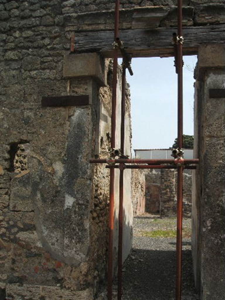 IX.8.b Pompeii. May 2005. Looking east along north wall of fauces. According to Della Corte because of the graffito painted on the left wall in the vestibule, it proved this was a hospitium and the owners name as -
Hospitium C. Hygini Firmi     [CIL IV 3779]
See Della Corte, M., 1965.  Case ed Abitanti di Pompei. Napoli: Fausto Fiorentino. (p.165)
