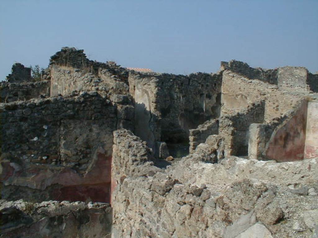 IX.8.b Pompeii. May 2005. Looking north-west over north wall from IX.8.6.
