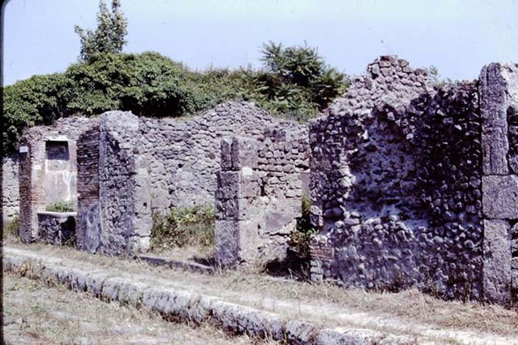 IX.9.8 on left, IX.9.7, centre, and IX.9.6, on right. Pompeii. 1966. Looking towards the south side of Via di Nola.  Photo by Stanley A. Jashemski.
Source: The Wilhelmina and Stanley A. Jashemski archive in the University of Maryland Library, Special Collections (See collection page) and made available under the Creative Commons Attribution-Non Commercial License v.4. See Licence and use details.
J66f0329
