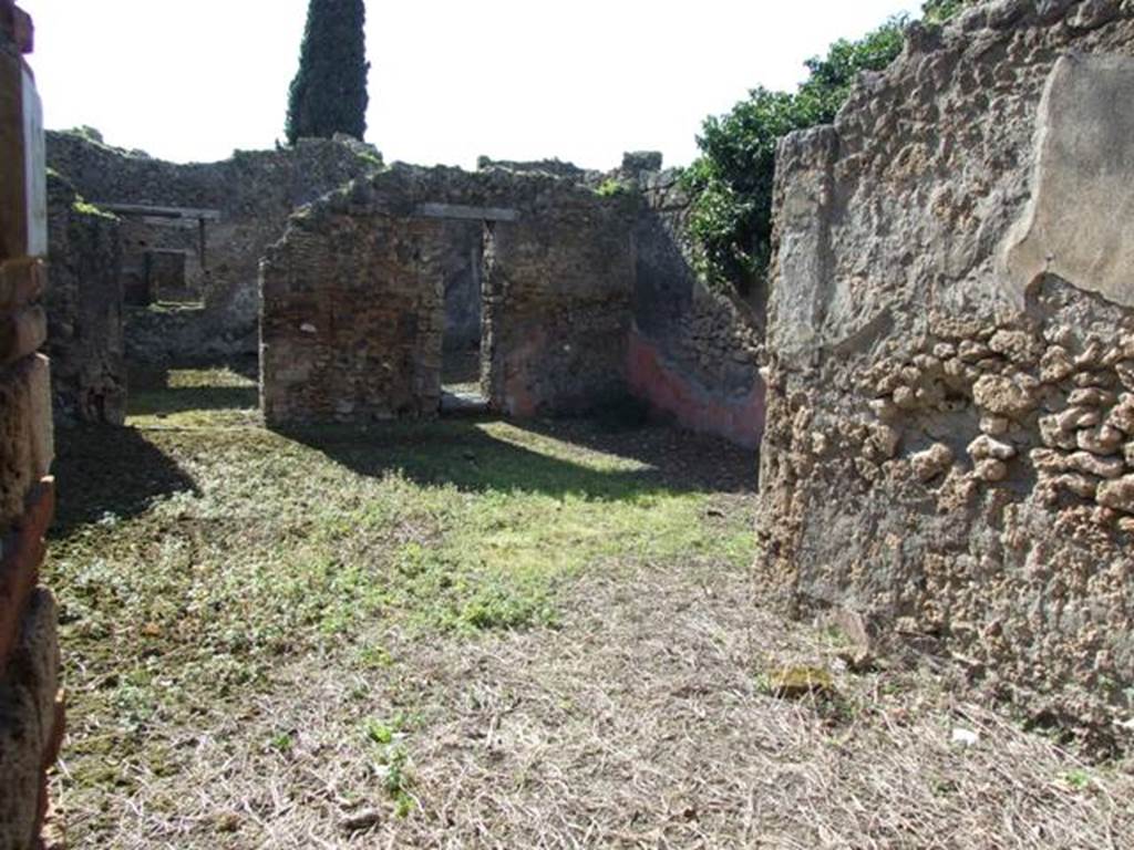 IX.9.12 Pompeii. March 2009. Looking west across room 11, from entrance doorway.
According to NdS, the entrance doorway was rather wide and it had a lava threshold. When excavated, a big iron hinge was still fixed into the threshold. The floor was of signinum, and much remained of the wall decoration which consisted of rustic plaster and high red zoccolo.
On the left of the entrance was the doorway to the stables, (our room 12) and on the right was a doorway to a cubiculum (our room 14).
See Notizie degli Scavi, 1891, p.256.