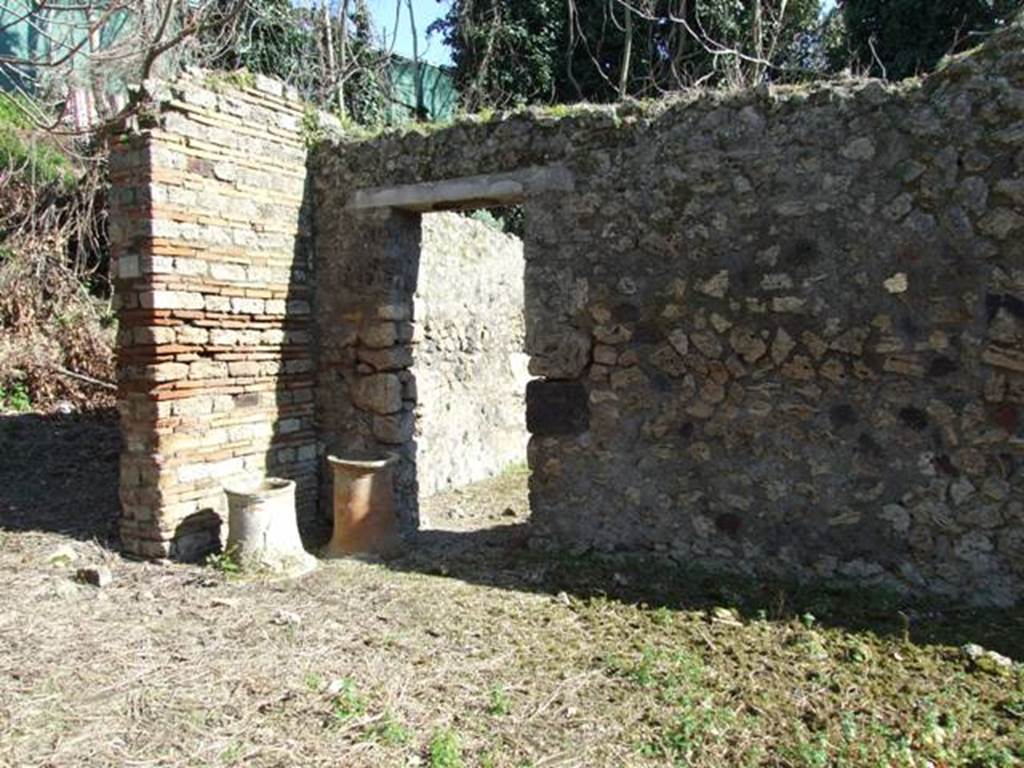 IX.9.12 Pompeii. March 2009. Looking south east across entrance yard to Doorway to Room 12, Stables.