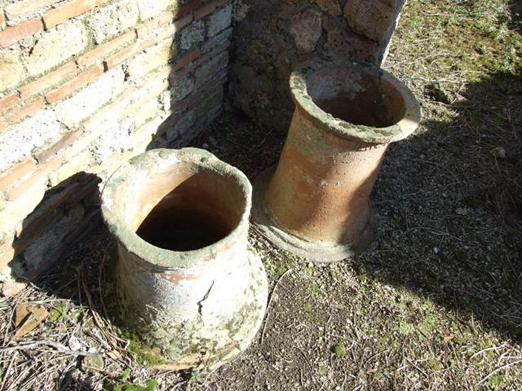 IX.9.12 Pompeii. March 2009. Two terracotta puteals.