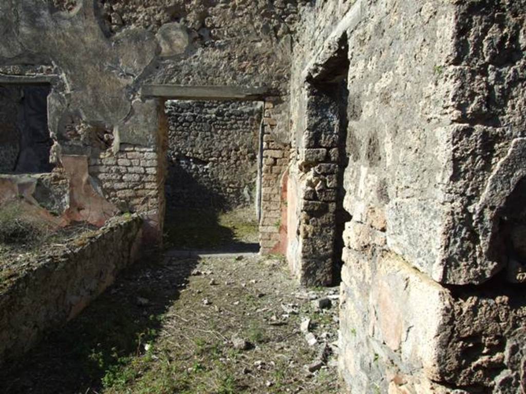 IX.9.13 Pompeii. March 2009. Looking north along the passageway on the east side of the garden, towards doorway to Room 13, Triclinium of IX.9.12, and on the right is the doorway to the Triclinium, Room 3.