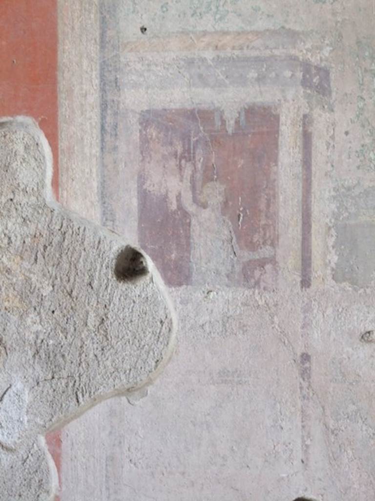 IX.9.c Pompeii. March 2009. Architectural painting with a figure, from east end of central panel on south wall of triclinium.
