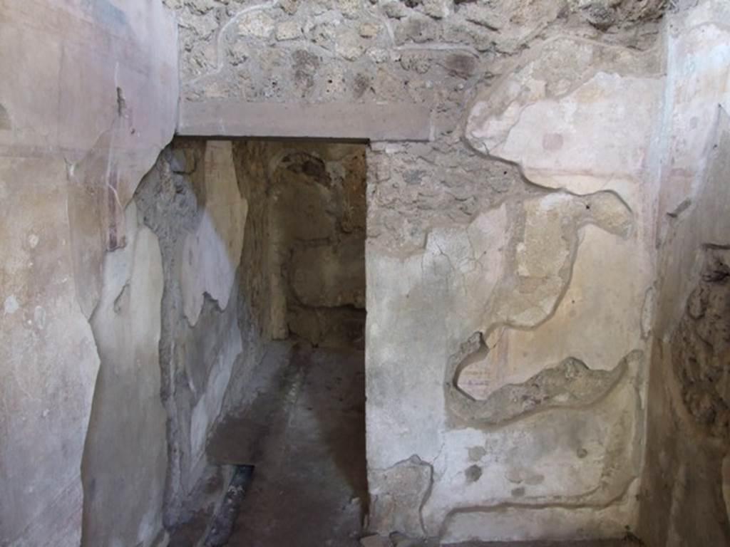 IX.9.c Pompeii. March 2009. West wall of anteroom, with doorway to small room or cupboard.