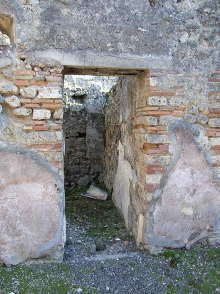 IX.9.d Pompeii. March 2009. Doorway to room m, cubiculum. According to NdS, this cubiculum would have had Opus signinum flooring and walls with white background.