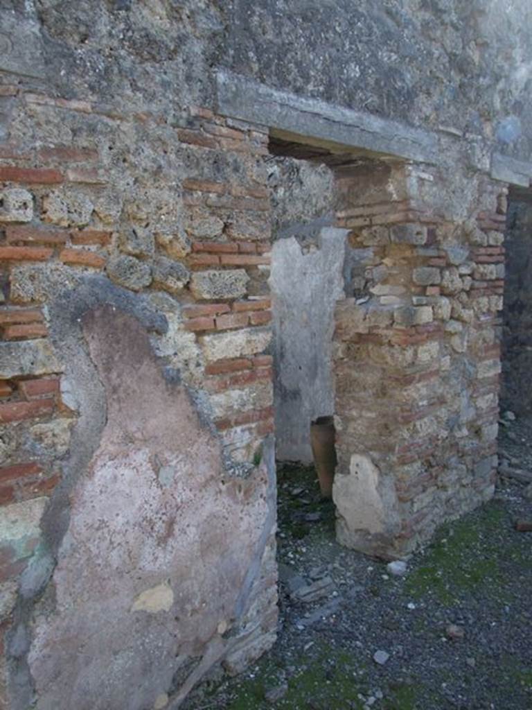 IX.9.d Pompeii. March 2009. Doorway to room g, cubiculum.
According to NdS, this cubiculum would have had Opus signinum flooring and walls with white background.
On the atrium wall pilaster dividing the doorways to rooms g and h, on the right, a graffito was found, it read –
CTXXXV
PLXXXVII
See Notizie degli Scavi, 1889, p.131.