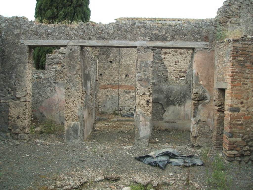 IX.9.d Pompeii. May 2005. Looking west across atrium b, to doorways to room k, entrance a, and rooms c and d.