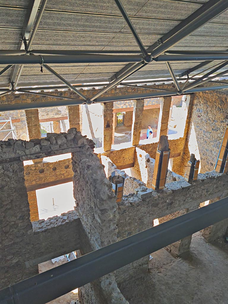 IX.12.5 Pompeii, on left. June 2024.
Looking south, with entrance corridor/fauces “a” of IX.12.4, centre right. Photo courtesy of Giuseppe Ciaramella.