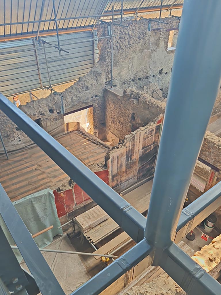 IX.12.6 Pompeii. June 2024. 
Looking east from above room “h”, towards room “m”, triclinium, and stable “n” with doorway at IX.12.8.
Photo courtesy of Giuseppe Ciaramella.

