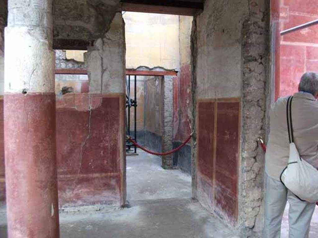 IX.12.9 Pompeii. May 2010.  Doorway to room 11 in north east corner of east portico.