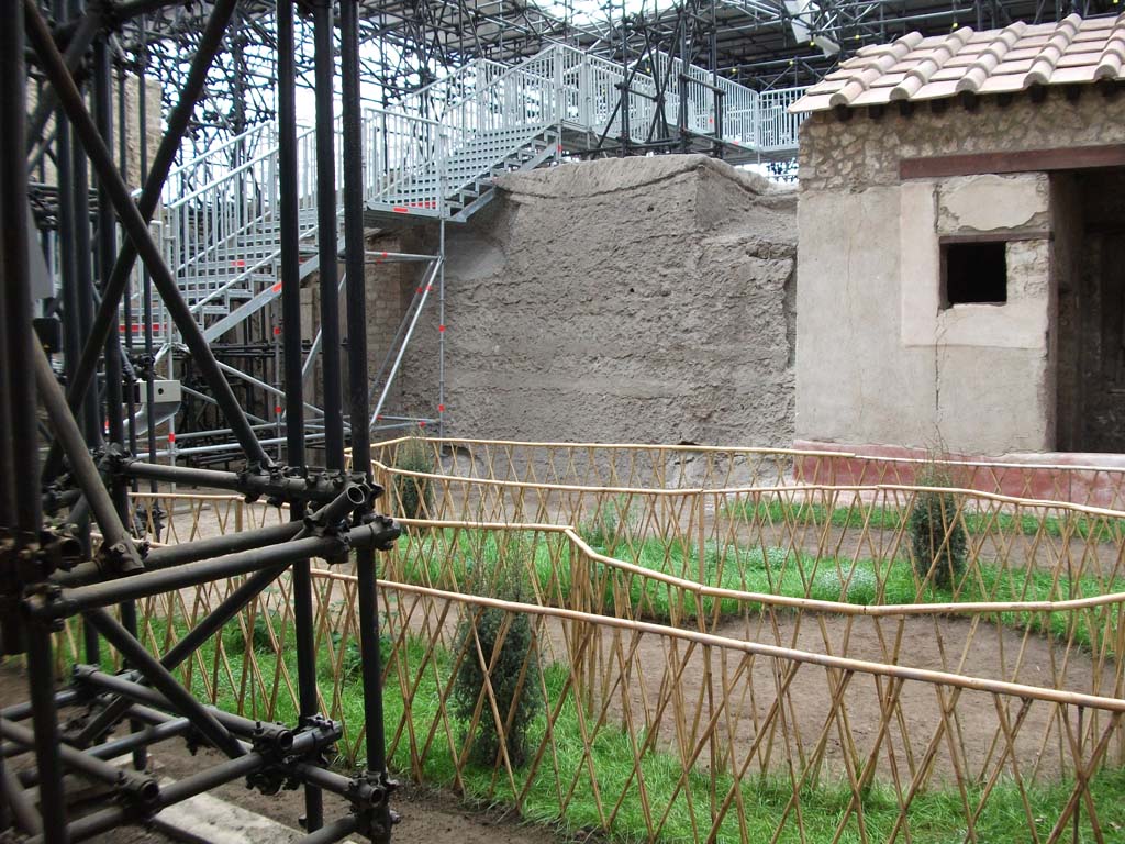 IX.12.9 Pompeii. May 2010. Looking west across peristyle/garden area 5 towards unexcavated area.
The unexcavated area has now been cleared and is seen on the plan as leading into room 10, with room 9 beneath the area of the steps.
