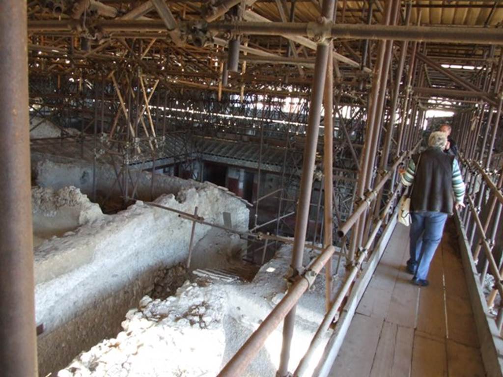 IX.12.A/IX.12.9 Pompeii. March 2009. West side. Looking east towards rooms partly excavated, and peristyle area.
