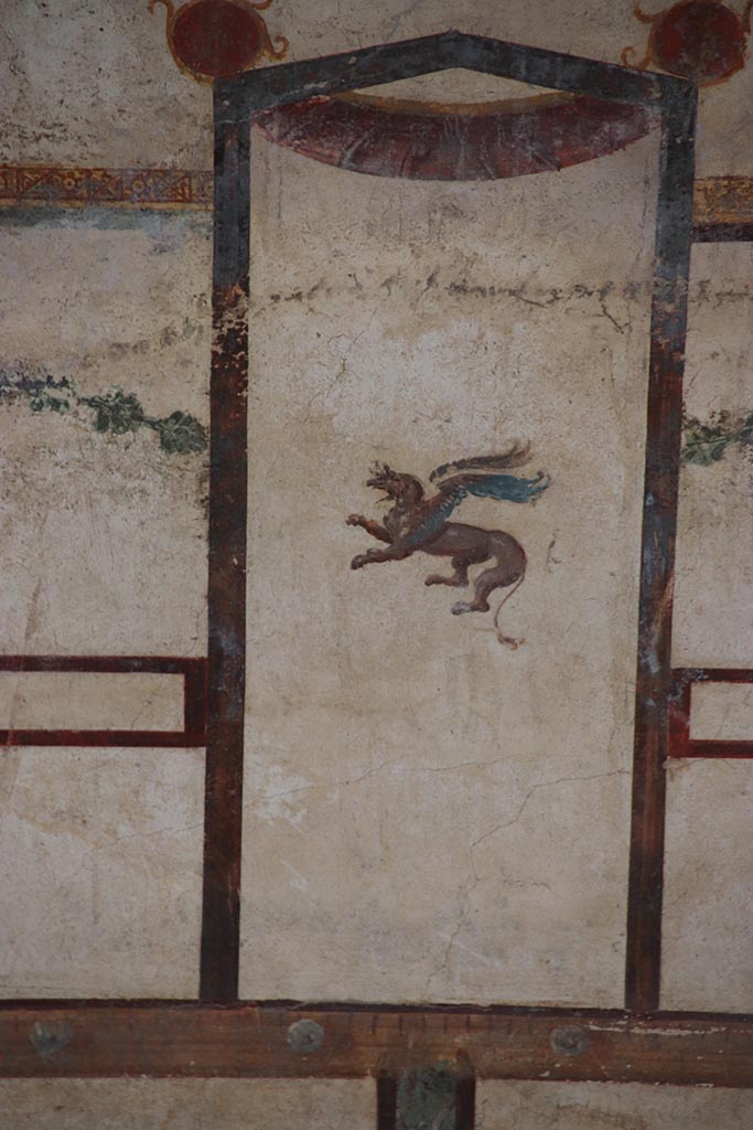 IX.12.9 Pompeii. October 2024. 
Room 13, detail of griffin from upper north wall at east end. Photo courtesy of Klaus Heese.


