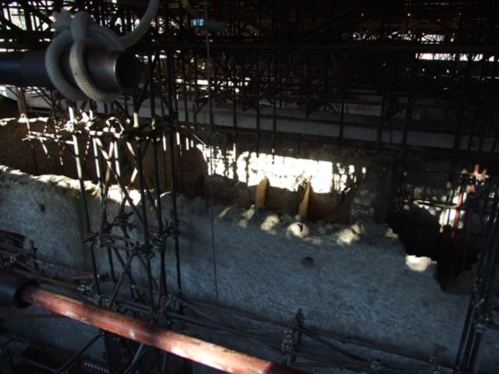 IX.12.B/IX.12.9 Pompeii. March 2009. Outside west wall of insula IX.12 from above, looking east across rooms 1,2,3 and 4.
(Our rooms 1,2,3 and 4 (from IX.12.9) are now thought to be part of a separate small house in the north-west corner of the Insula.
This house is now temporarily named as Casa di Fedra, House of Phaedra, see IX.12.B.
This contains rooms 5, 6, 7, 8, 9, 10, 11, 15 and 16, numbered on the plan.
Our room 1, on the new plan of the Insula is now shown as room 11.
Our room 2, is now shown as room 10.
Our room 3, is now shown as room 9.
Our room 4, is now shown as room 8.
It also covered the area of our rooms 6 and the area on the west side of it (unnumbered on our photos, but now numbered 5 on the plan).
Our room 6, is now shown as rooms 6 and 7.
Also included is area 15, covered with a collapsed roof, and room 16 on the south side of area 15.
Rooms 19, 20, 21 and 22, together with area “a”, could also possibly be part of this same house.)