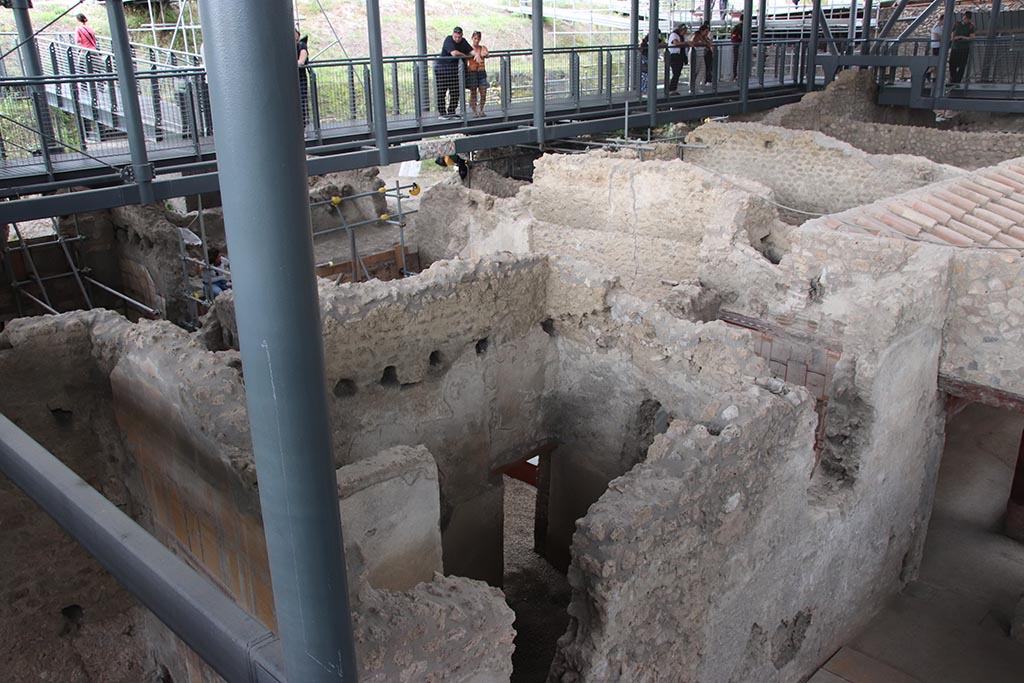 IX.12.B Pompeii. October 2024.
Looking north-east, with east wall of room 5, on left, and room 7/6 in centre, and room 16, on right. Photo courtesy of Klaus Heese.