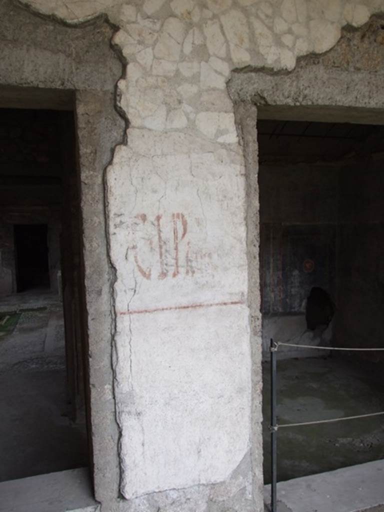 IX.13.1-3 Pompeii. March 2009. Graffiti between the rooms 14 and 15.