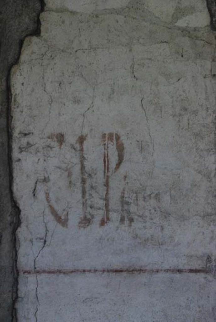 IX.13.1-3 Pompeii. October 2007. Detail of graffiti between the rooms 14 and 15.
Photo courtesy of Nicolas Monteix.
According to Giordano and Casale, this was found on 21st June 1972 written in red on a pilaster on the south side of the peristyle. C(aium) . I(ulium) . P(olibium) . II . VIR
See Giordano, C and Casale, A: Iscrizioni Pompeiane Inedite Scoperte Tra Gli Anni 1954-1978, (p.284).